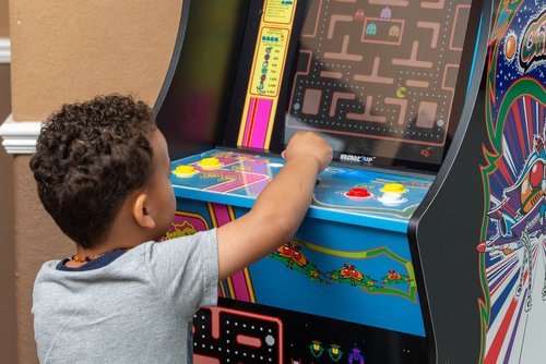 Child patient playing a video game in the dental waiting room