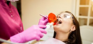 Dentist performing a deep cleaning for gum health.
