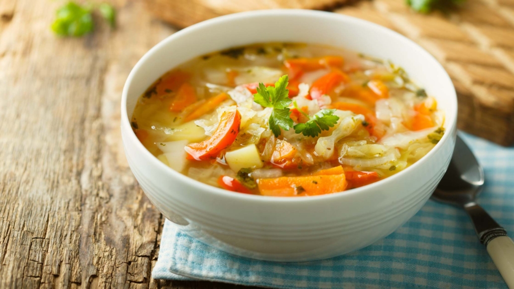 Bowl of healthy food for post-dental implant care.