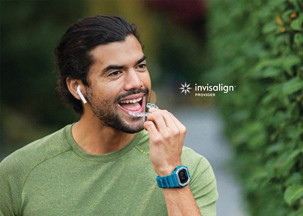 Active person wearing Invisalign aligners while on the go.
