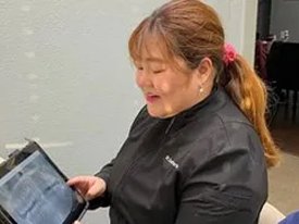 Dental staff member educating a patient about their wisdom teeth