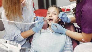 A well prepared child at a dental visit who is smiling and behaving well