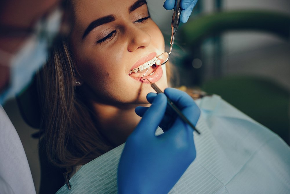 Beautiful girl wearing Invisalign aligners